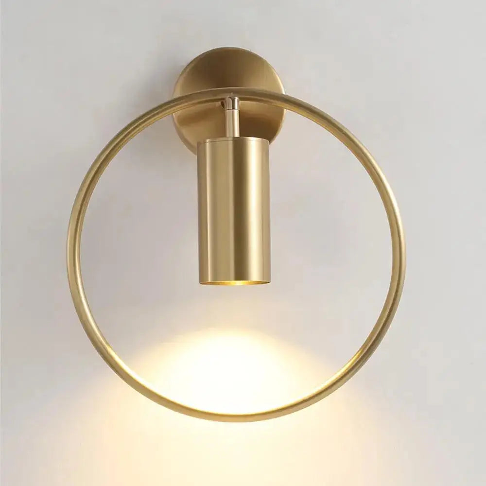 DecorBites™ modern black gold wall sconce with brass-finished circular base and cylindrical wall lamp fixture