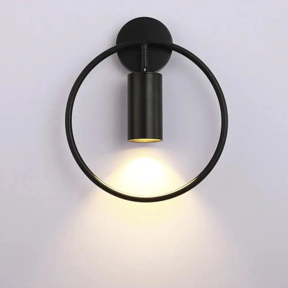 Decorbites modern gold and black wall sconce wall lamp with black circular matte finish and warm focused light