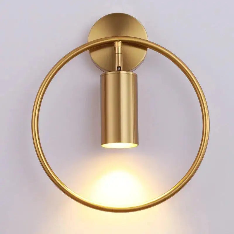 Decorbites modern black gold wall sconce with gold finish circular base and cylindrical light fixture minimalist design wall lamp