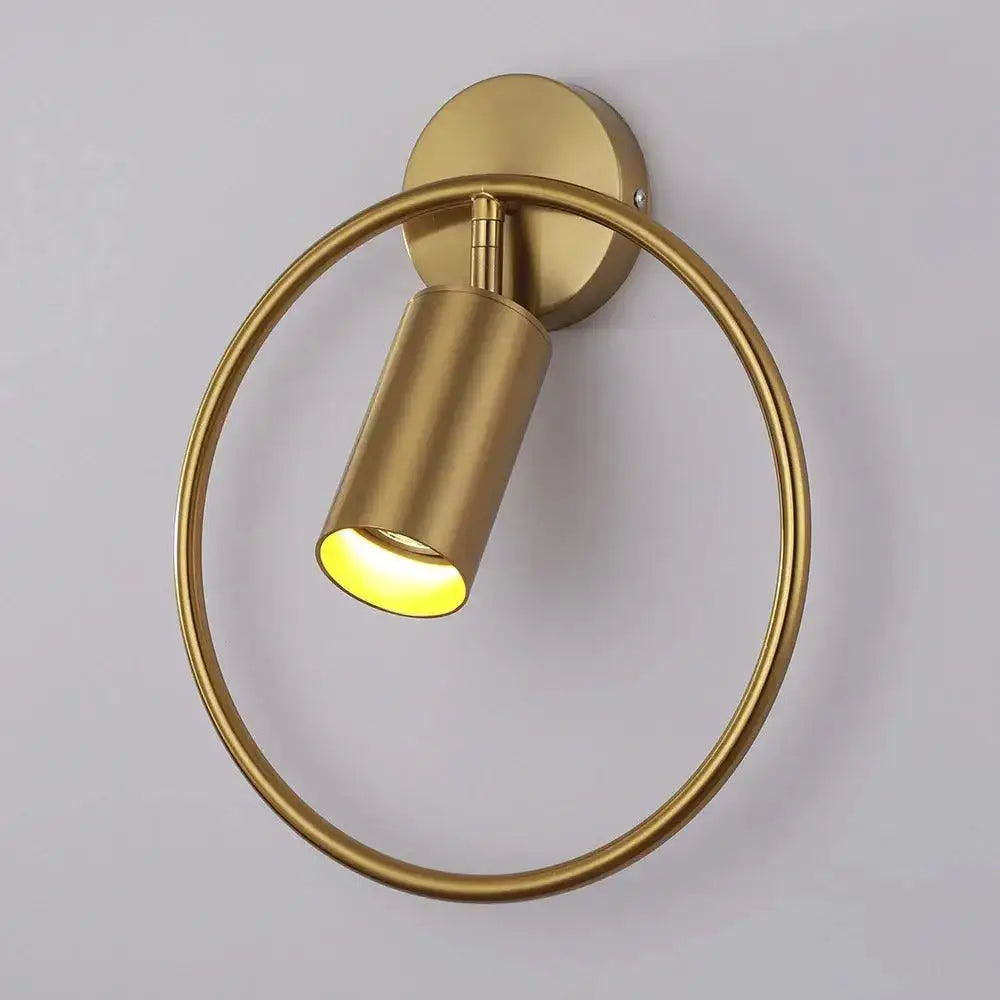 DecorBites™ modern gold and black wall sconce with gold finish, circular ring design, and warm yellow light wall lamp