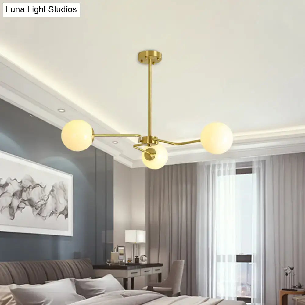 Decorbites modern gold ceiling light with white glass shades featuring three frosted globes for bedroom use