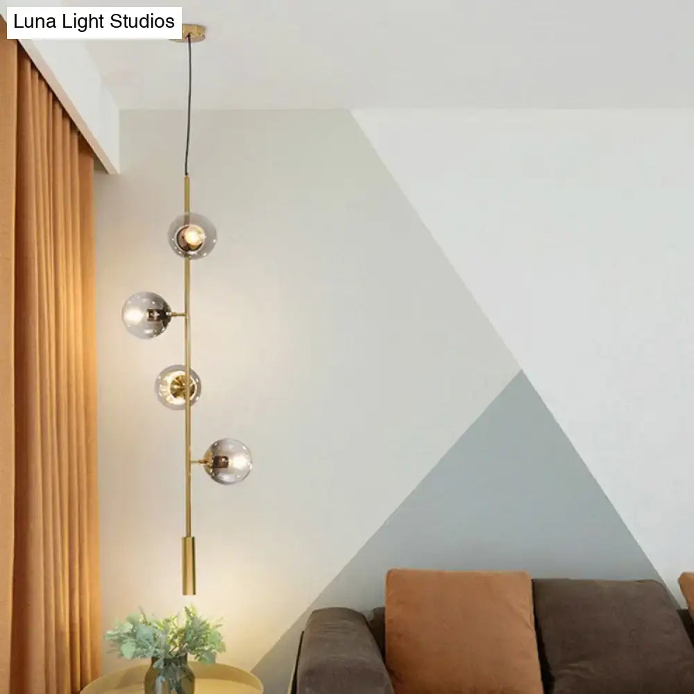 DecorBites modern gold linear chandelier with slender brass rod and four smoke gray glass shades hanging pendant light