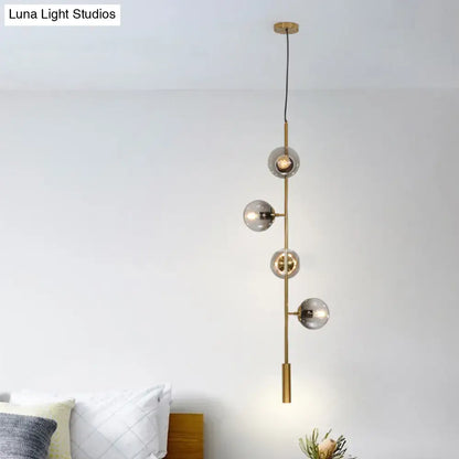 Decorbites™ modern gold linear chandelier with four gray glass shades and brass-finished metal hanging fixture