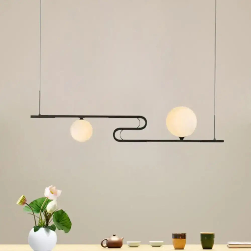 Modern black metal hanging chandelier with two frosted glass globes by decorbites simplicity modo for dining hall island