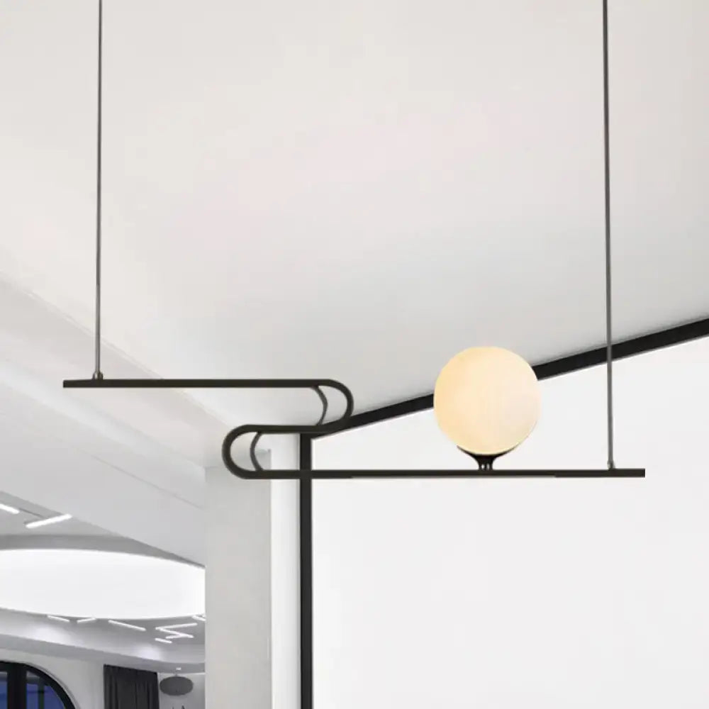 Black metal hanging chandelier with spherical frosted glass bulb from DecorBites™ simplicity modo for dining hall island