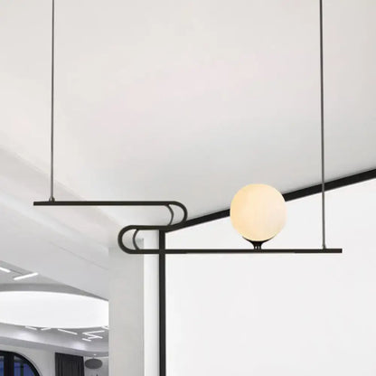 Black metal hanging chandelier with spherical frosted glass bulb from DecorBites™ simplicity modo for dining hall island