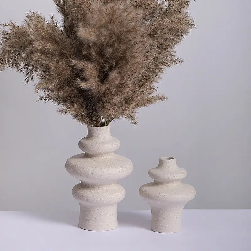 Cream-colored ins style ceramic spiral vase by DecorBites™ with stacked rounded segments and textured surface