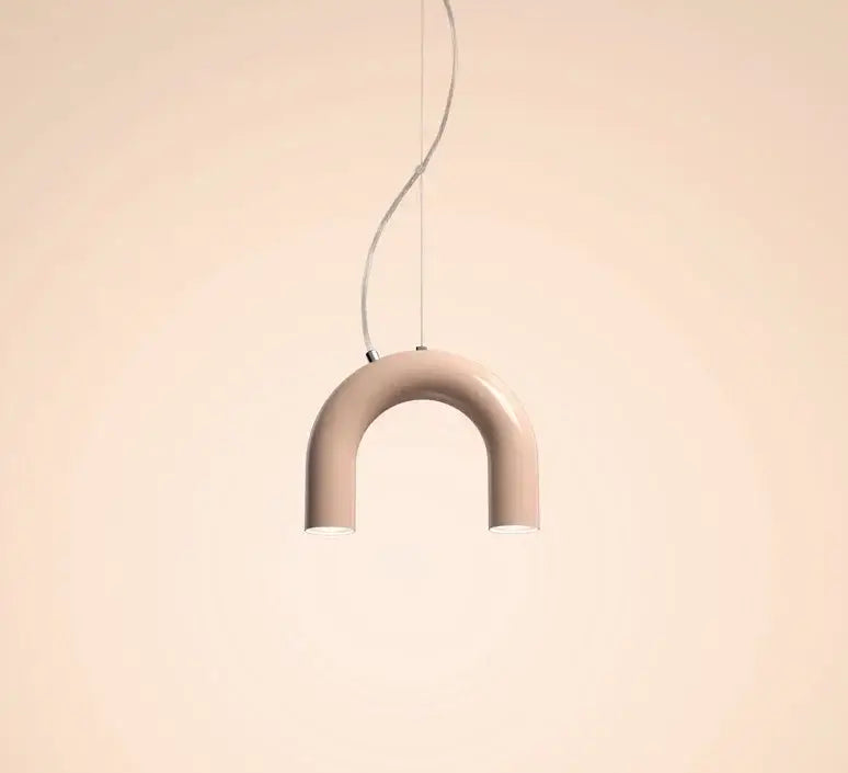 A sleek matte beige u-shaped oblure arch chandelier with minimalist design and thin metallic cord suspension