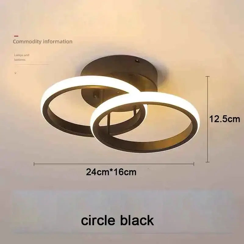 Modern black circular led chandelier with two intersecting rings and three color options for household use by DecorBites