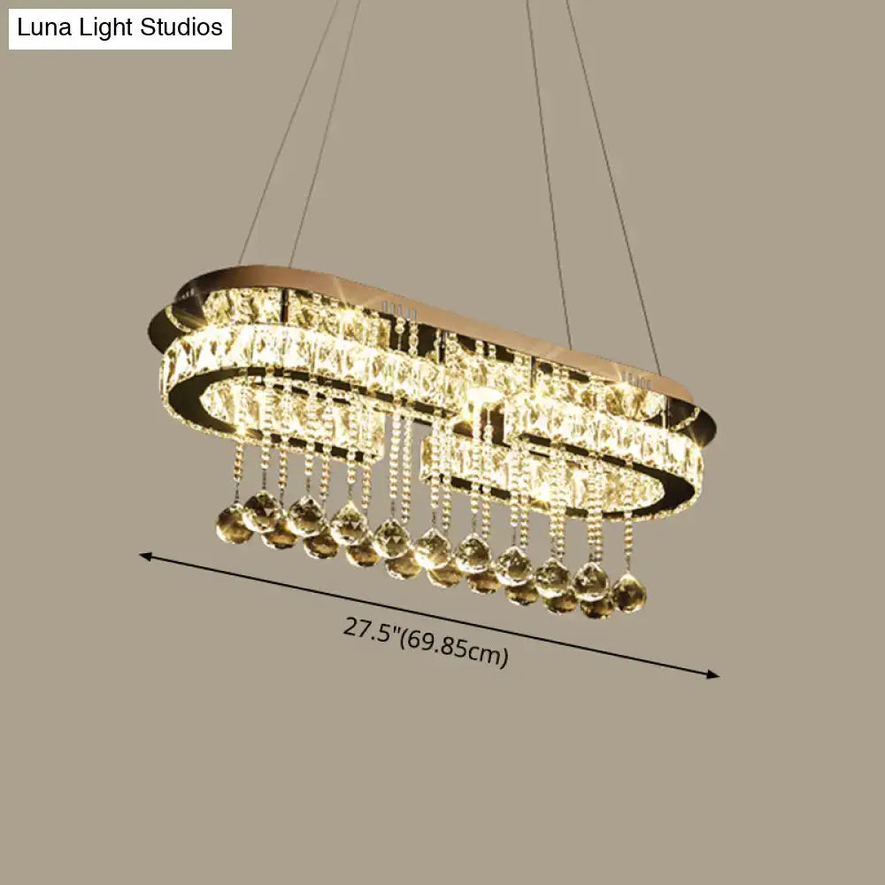 Elegant oval-shaped modern led crystal pendant light with stainless steel frame gold-toned and teardrop crystals