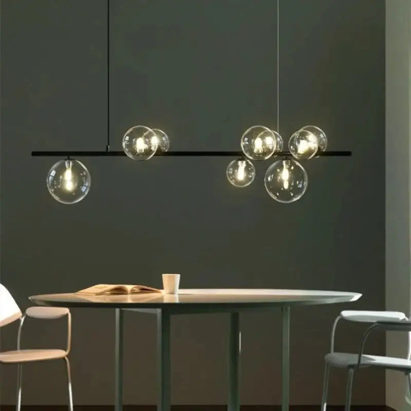 DecorBites modern black metal chandelier with clear glass bubble bulbs and adjustable cord for versatile lighting