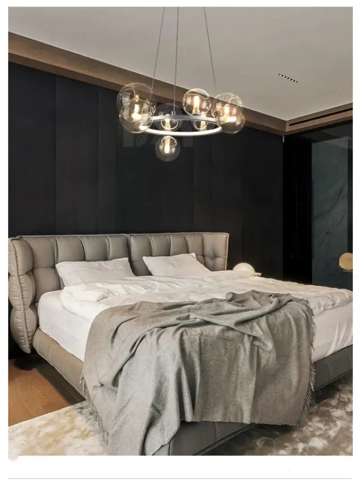 DecorBites™ modern LED glass chandelier with adjustable cord, clear glass bubbles, sleek metallic ring, and warm bulbs