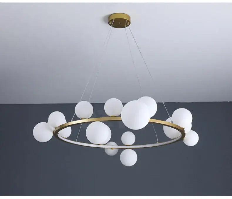 DecorBites™ modern gold-toned chandelier with clear glass frosted spheres and adjustable cord for versatile lighting
