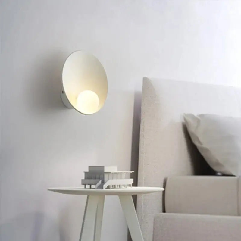Minimalist white decorbites™ led wall light with smooth circular design and warm ambient lighting for modern interiors