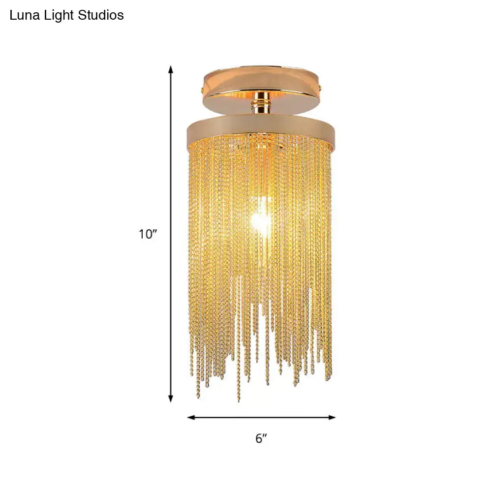 Gold-toned decorbites semi flush mount lamp with cascading crystal chains and sleek modern metal design for living room