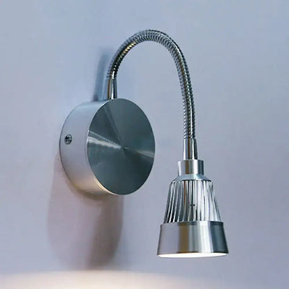 Silver metallic wall-mounted reading lamp with flexible gooseneck and ribbed shade in chrome finish by DecorBites modern metal led