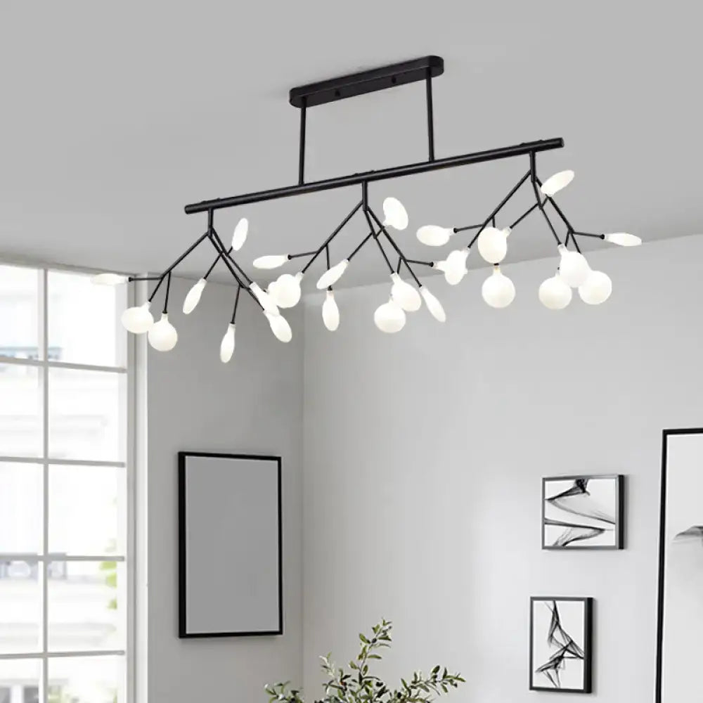Black metal linear island chandelier with branching arms and frosted glass globe bulbs for modern lighting