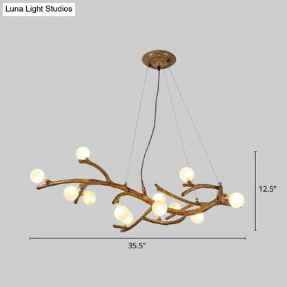 Bronze-finished metal tree branch chandelier with frosted glass globes and art deco wood suspension for island lighting