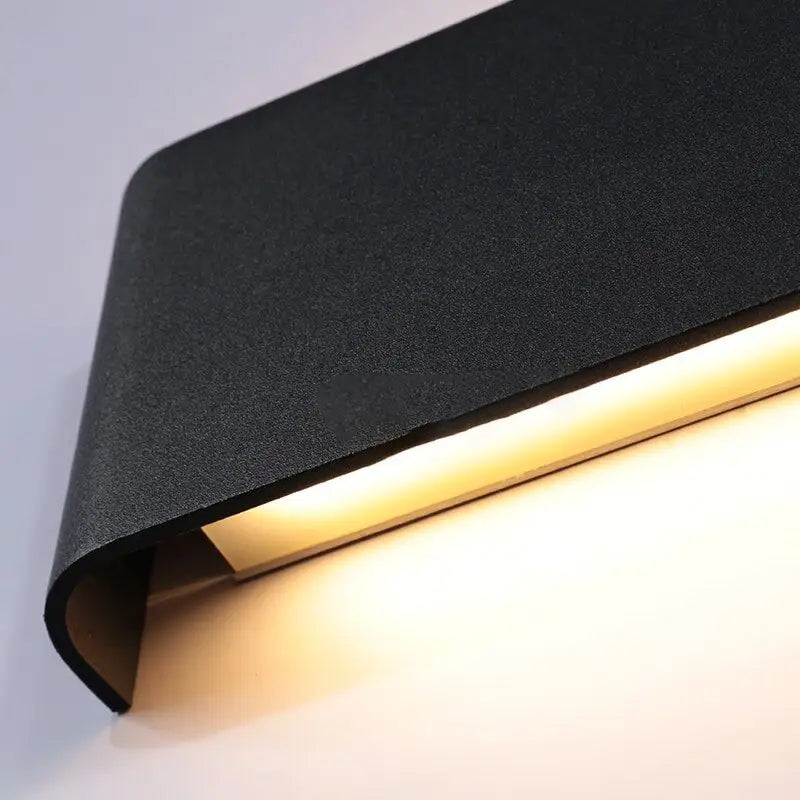 DecorBites™ modern metal wall sconces with black textured finish and warm led illumination for stylish lighting