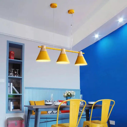DecorBites modern metallic cone hanging light kit with three yellow conical shades and wood top fixture for island lighting