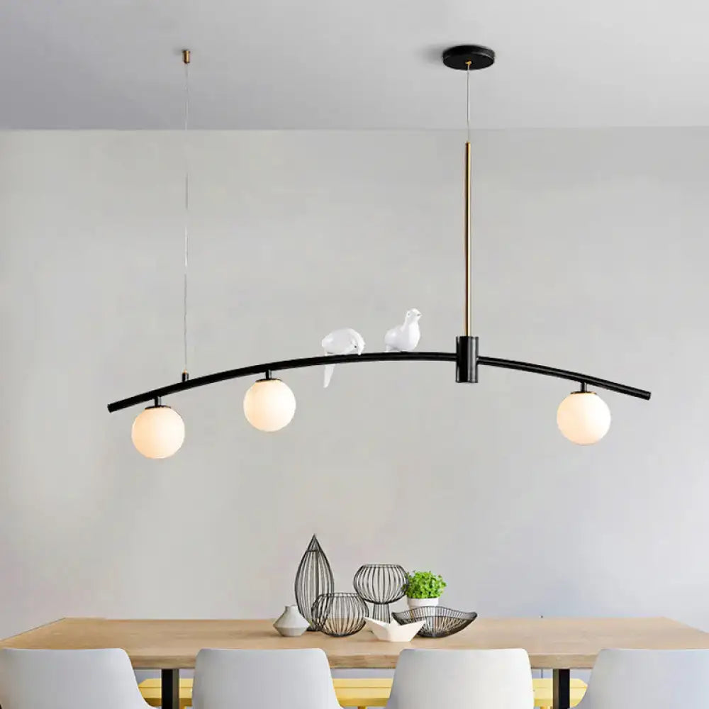 Decorbites modern black brass pendant light with milk glass bulbs and decorative white bird decoration on arms