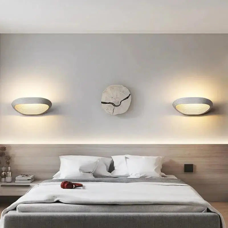 Decorbites™ modern minimalistic wall sconces in gray with ribbed oval design and warm ambient lighting for minimalistic wall decor