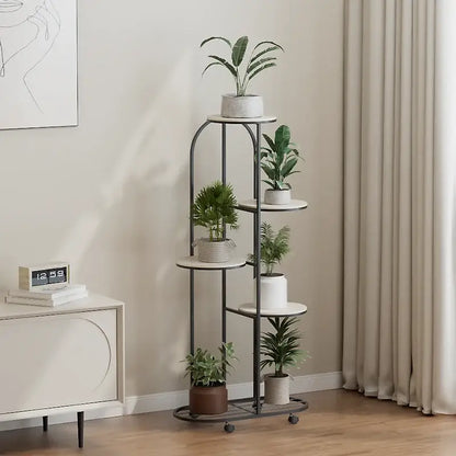 DecorBites modern black metal plant stand with five white circular shelves and caster wheels for interior decor