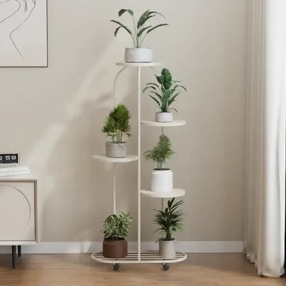 White five-tier metal plant stand with curved frame and wheels for interior decor and flower rack use by DecorBites™