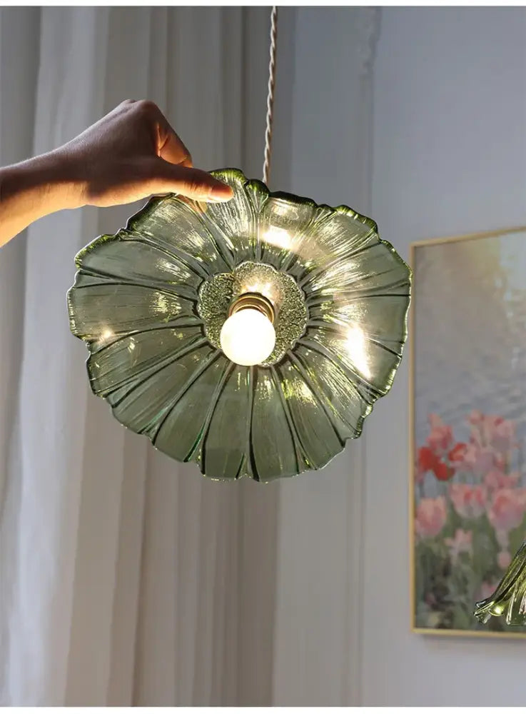 A delicate green glass decorbites modern nordic ceiling light with petal design and central bulb for e27 ceiling use