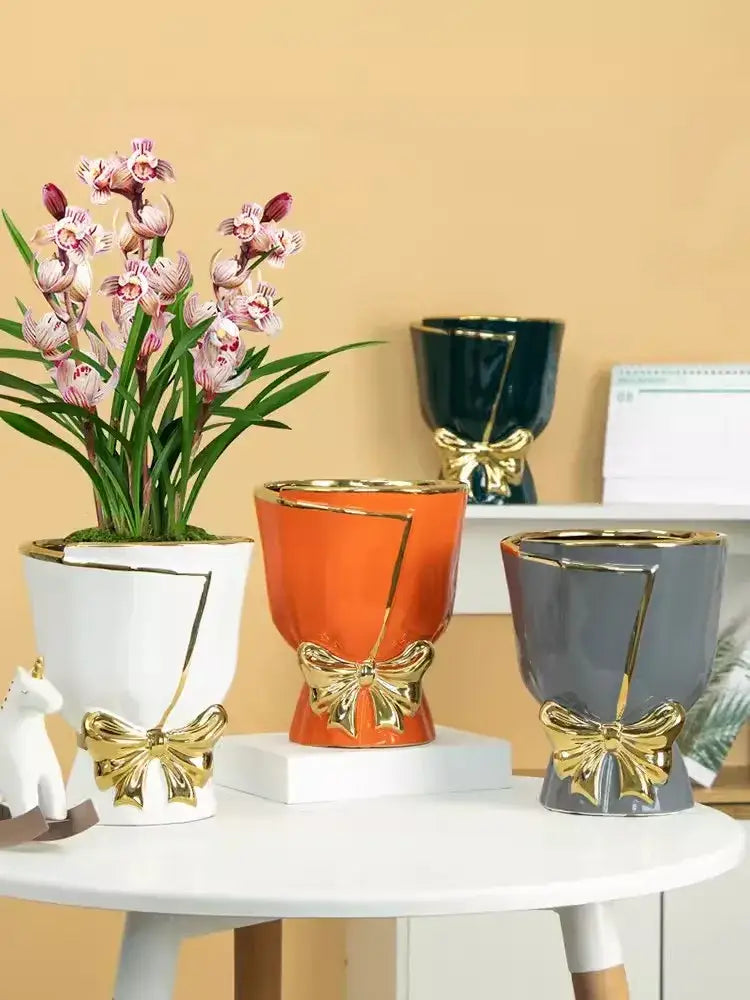 White ceramic vase with gold geometric accents and bow design modern nordic style for elegant home decor