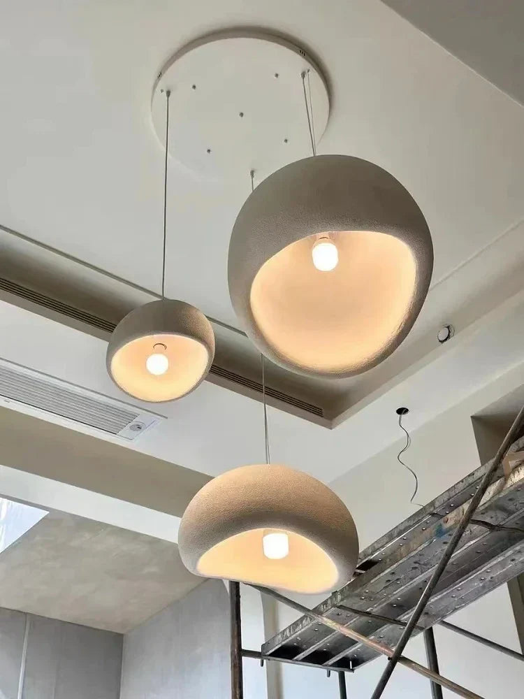 Modern nordic chandelier decorbites with warm light turn and minimalist concrete spherical pendant lights for home and dining