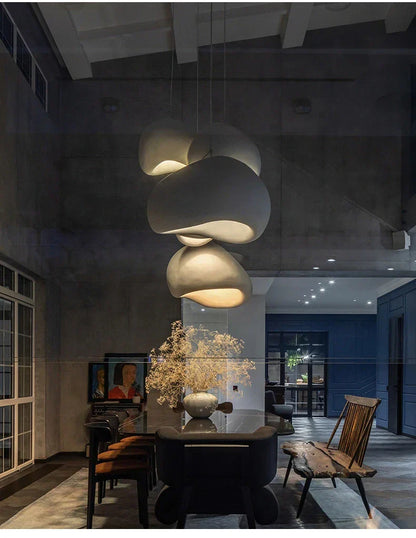 DecorBites modern nordic chandelier with matte white ceramic layered cloud-like shades emits warm light for home and dining
