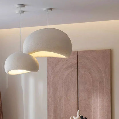 Two off-white matte textured pendant lights with dome shape in decorbites™ modern nordic chandelier for warm light ambiance