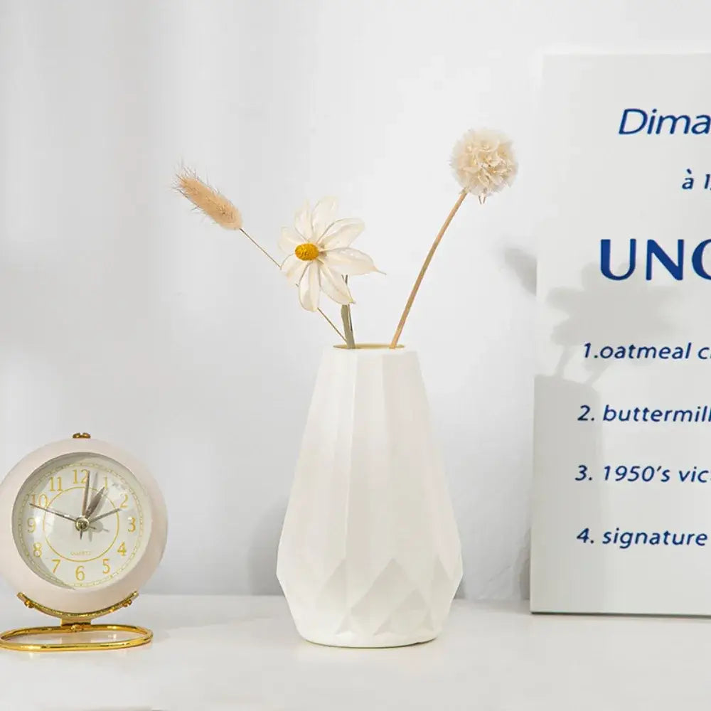 White ceramic diamond shaped flower vase with a faceted geometric design by DecorBites™ Modern Nordic