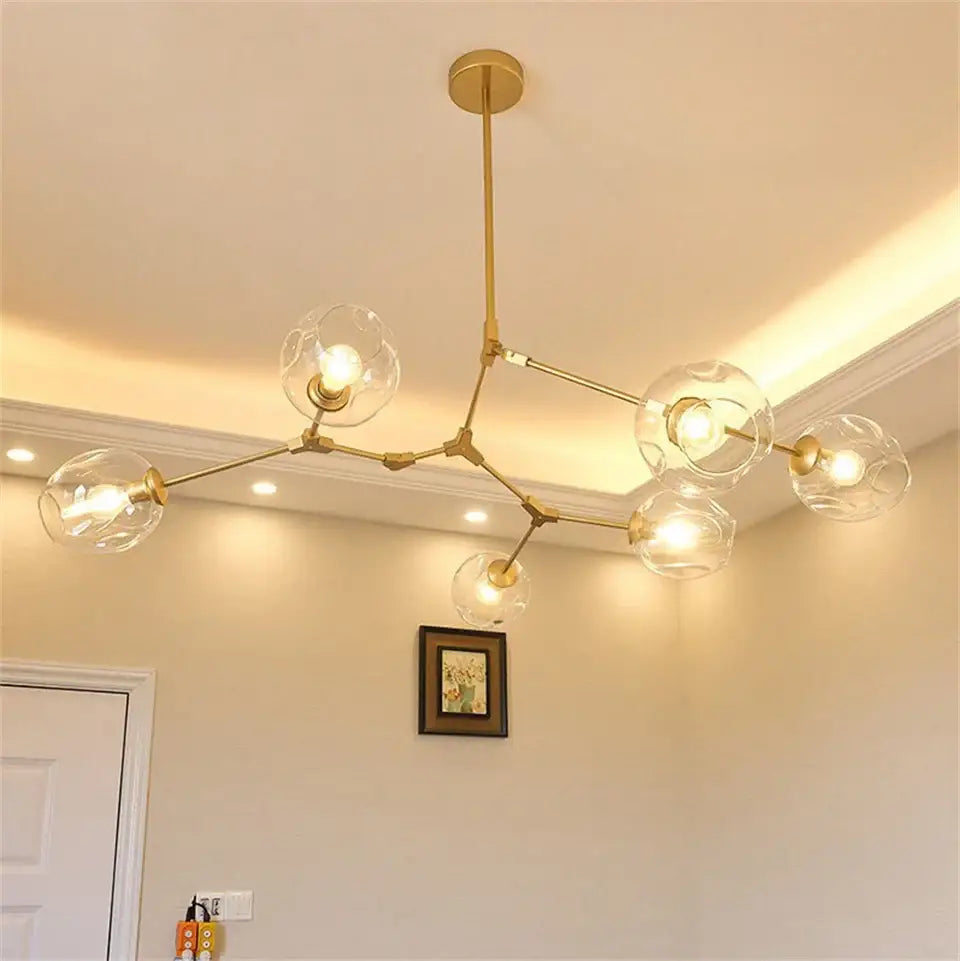 Gold-toned modern nordic glass chandelier with clear glass globe bulbs from decorbites glass chandeliers and pendant lamps