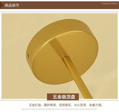 Gold-colored circular ceiling mount with sleek metallic finish and cylindrical stem for modern nordic glass chandeliers