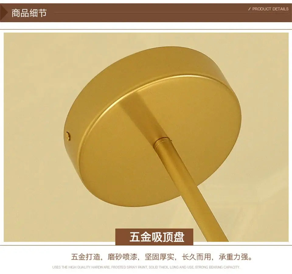 Gold-colored circular ceiling mount with sleek metallic finish and cylindrical stem for decorbites modern nordic glass chandeliers