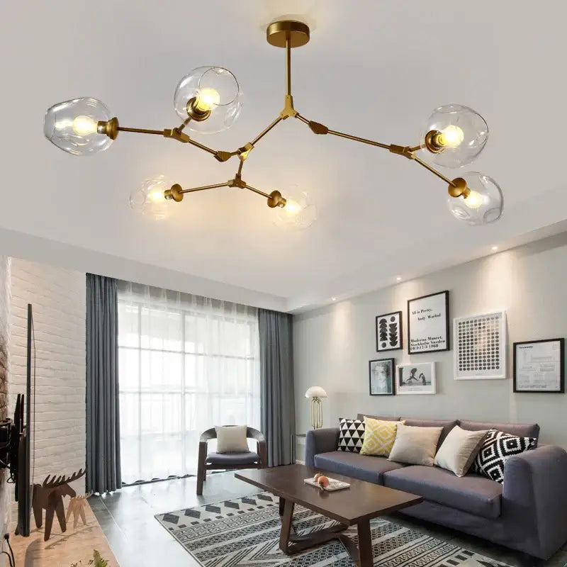 DecorBites™ modern nordic glass chandelier with gold-toned branching design and clear glass globe bulbs