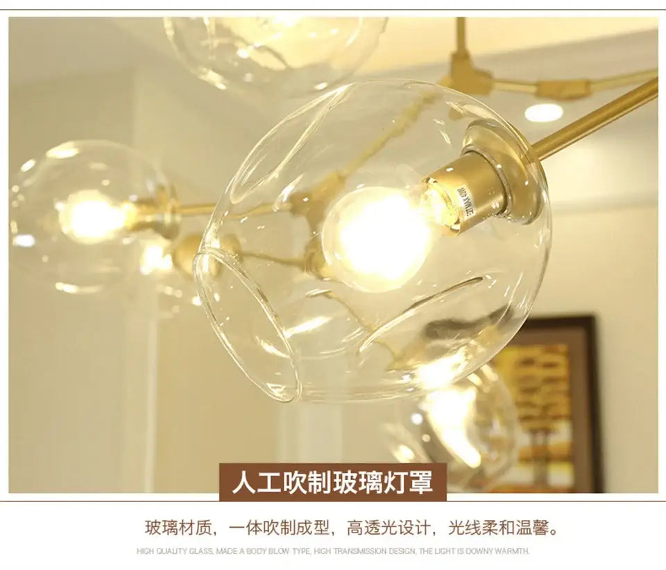Clear hand-blown nordic lustre glass chandeliers with warm golden brass fixture and integrated led lighting by DecorBites