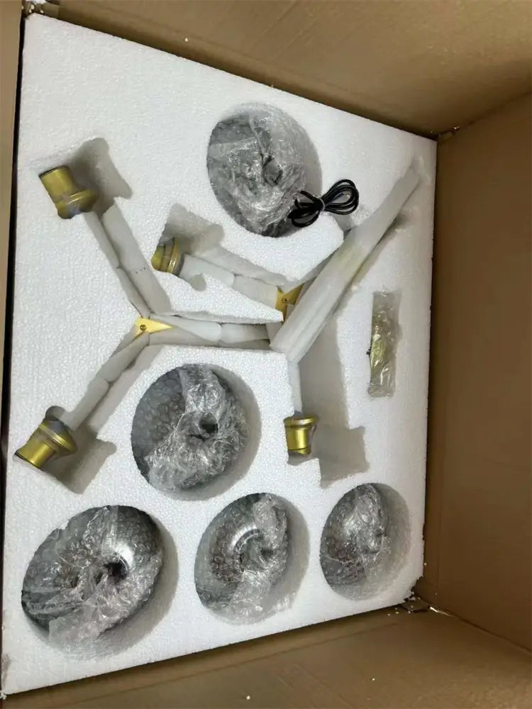 Set of five silver ammonite-shaped nordic lustre decorative objects with gold caps for modern nordic glass chandeliers packaging
