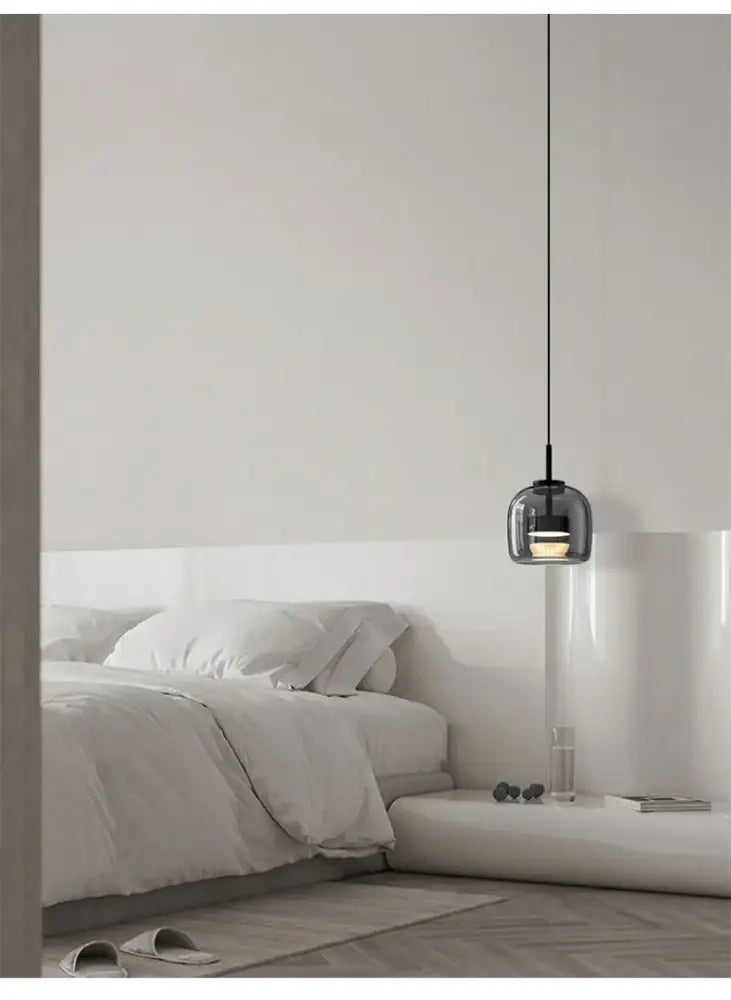 Decorbites modern nordic glass pendant lamp with dark glass globe and black cord pendant lamp above bed