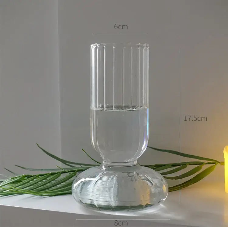 Clear glass DecorBites™ modern nordic vase with vertical ridges and fluted base filled halfway with water, height 750px width 750px