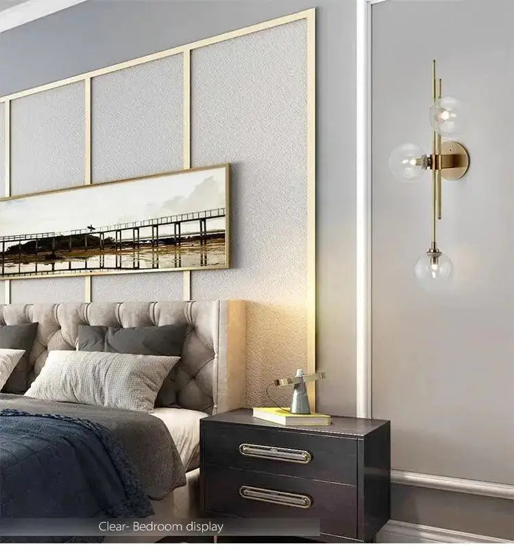 DecorBites modern nordic brass wall sconce with three clear glass globe bulbs featuring a green glass shade
