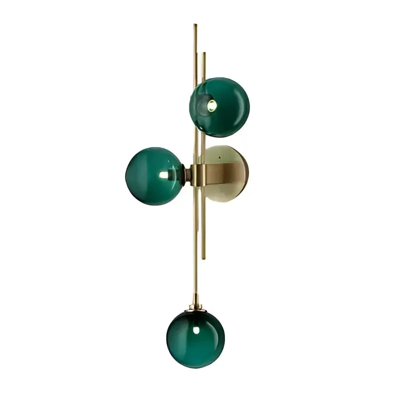 Decorbites modern nordic wall sconce featuring an emerald green glass shade with brass accents by adabella