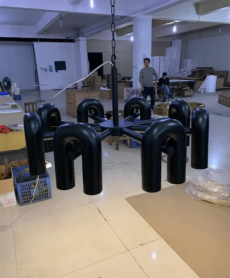 Black matte metal led ceiling chandelier with modern geometric design and eight curved arms by DecorBites™