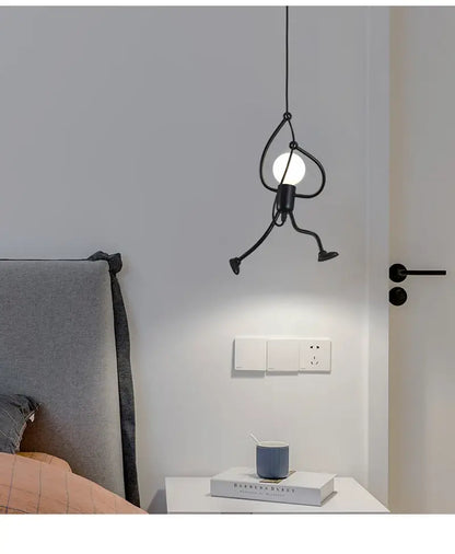 Black metal stick figure pendant light with round bulb center featured in decorbites™ modern nordic pendant light for home decoration