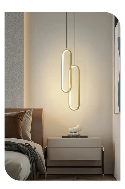 Decorbites™ modern nordic pendant light with gold-toned oval design hangs above bedside table for home decoration