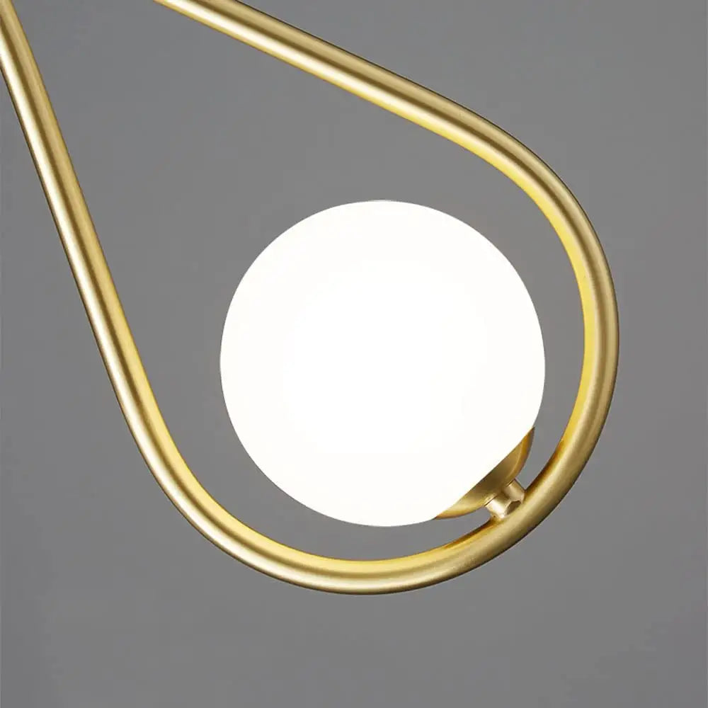 Gold-toned DecorBites™ modern nordic pendant light featuring a teardrop-shaped frosted glass globe pendant light