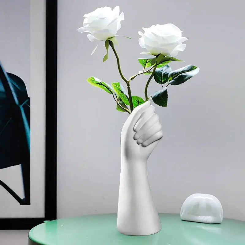White ceramic hand vase holding two white roses in modern nordic style by DecorBites™