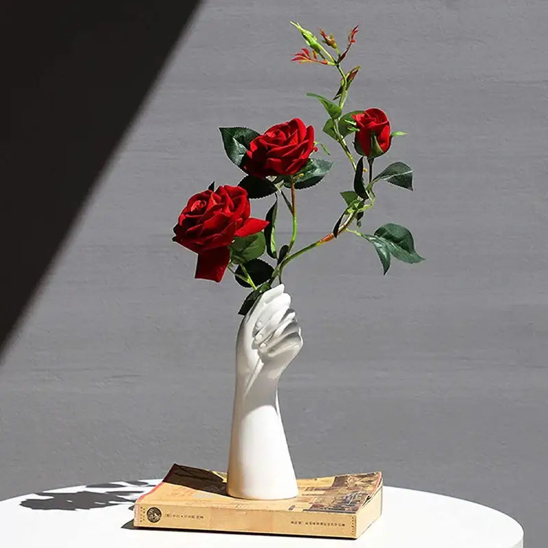 White ceramic hand vase holding roses in modern nordic style by decorbites™ for elegant home decor